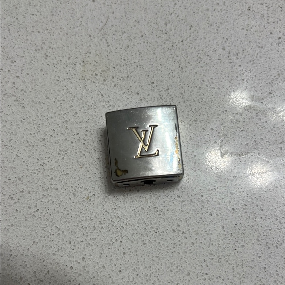 Stamped authentic Louis Vuitton Metallic Cube Charm